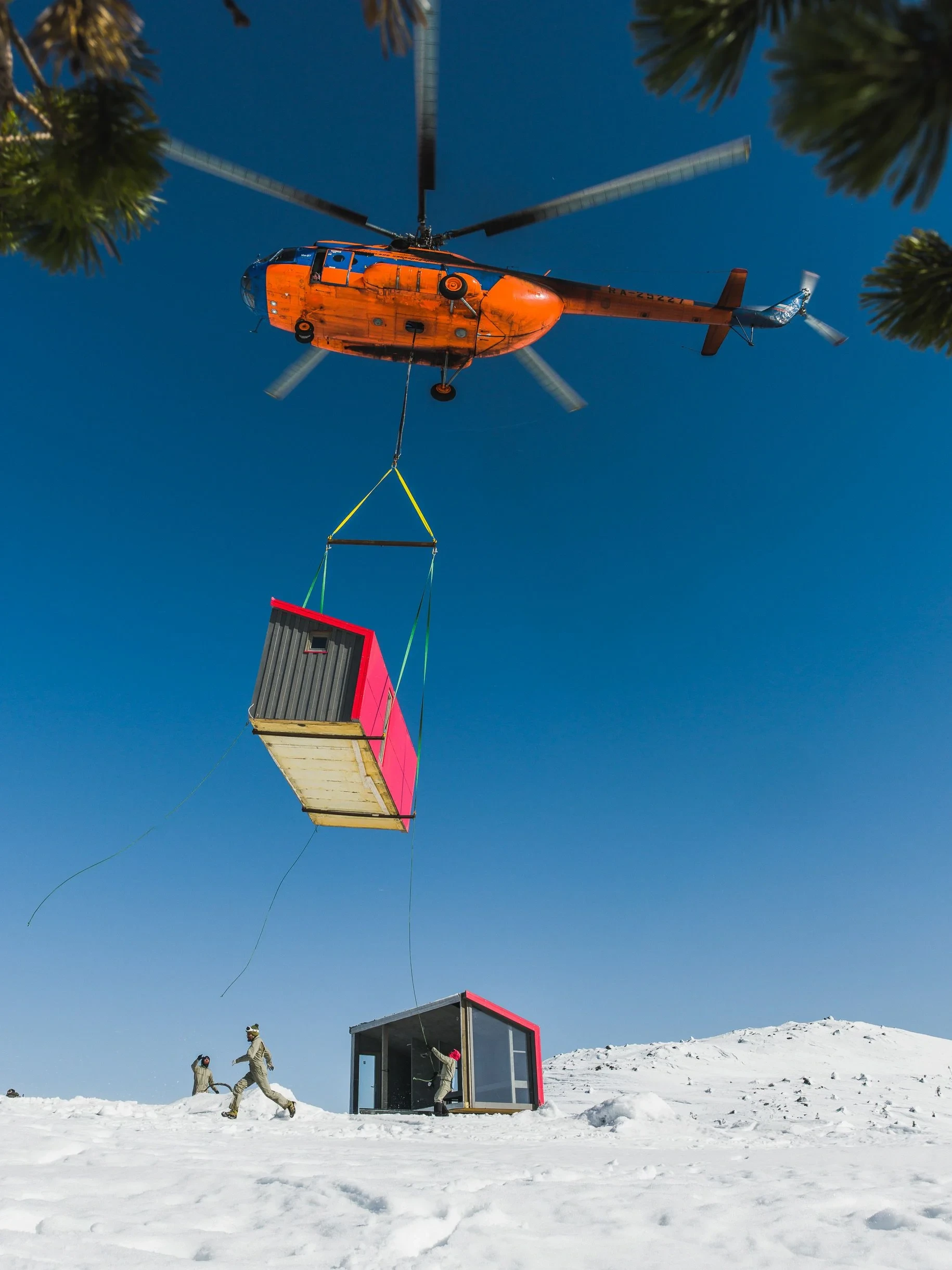 Helicopter lowering module beside installed cabin