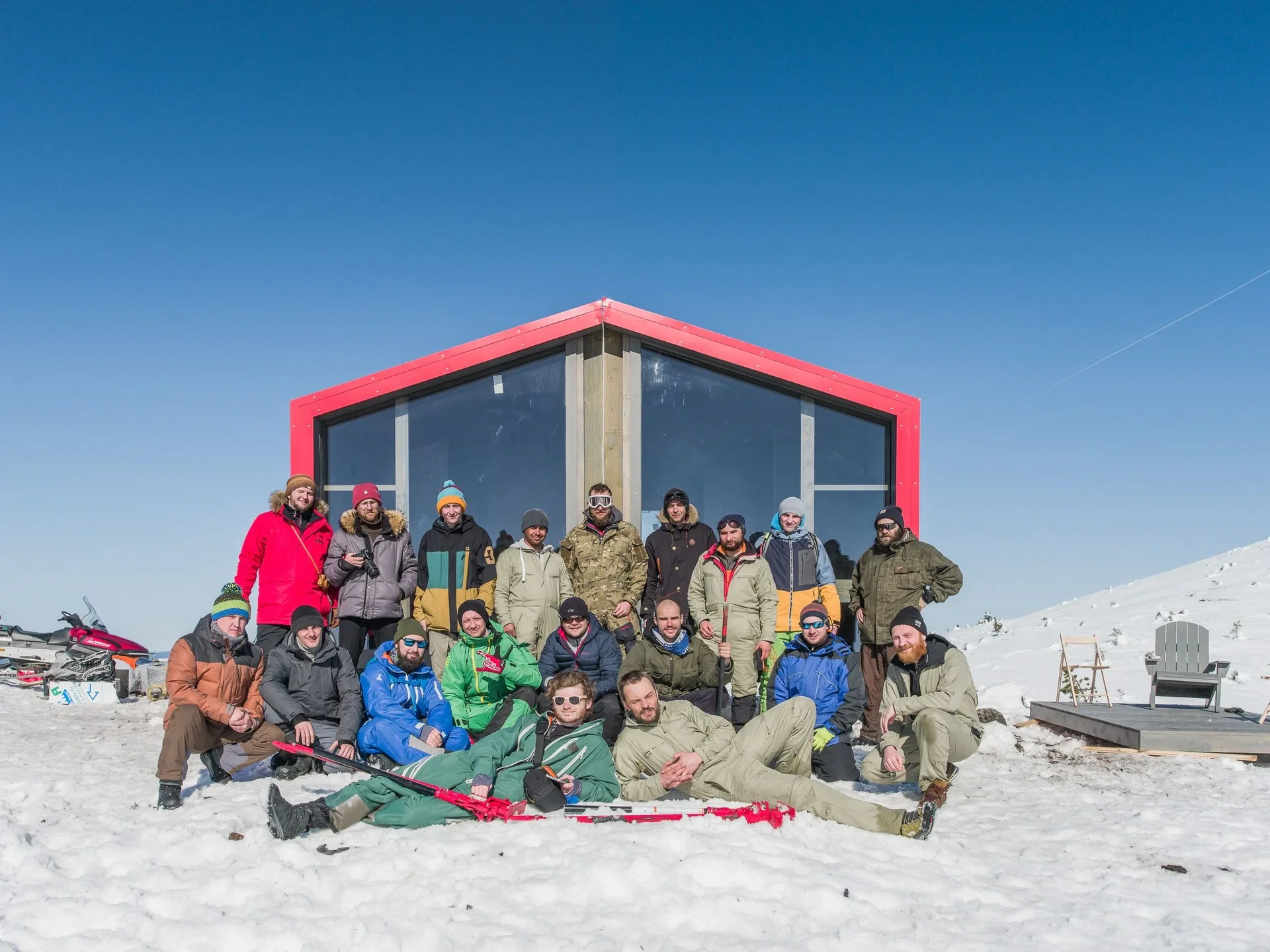 Group portrait in front of finished cabin