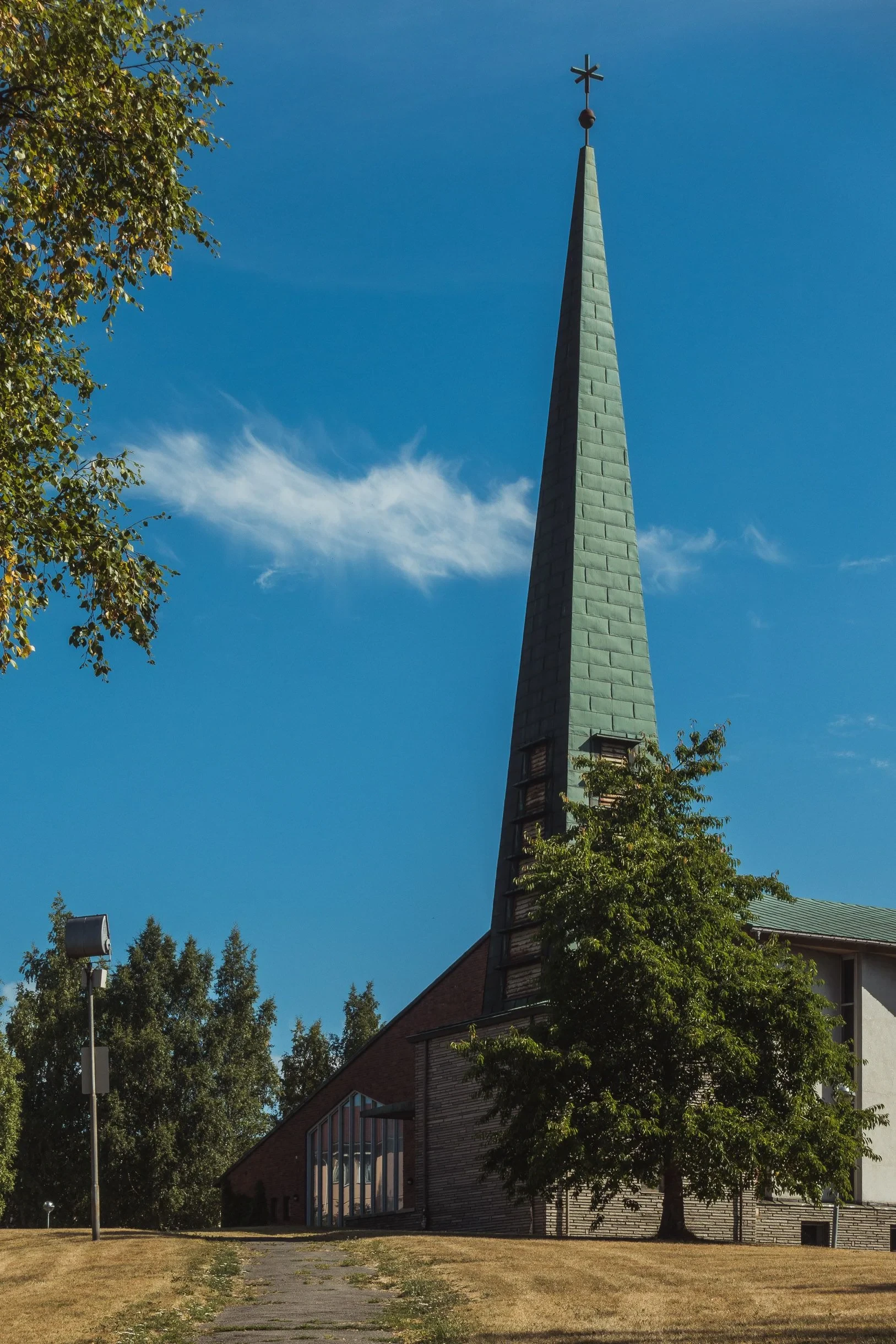 Church with tall slender green spire