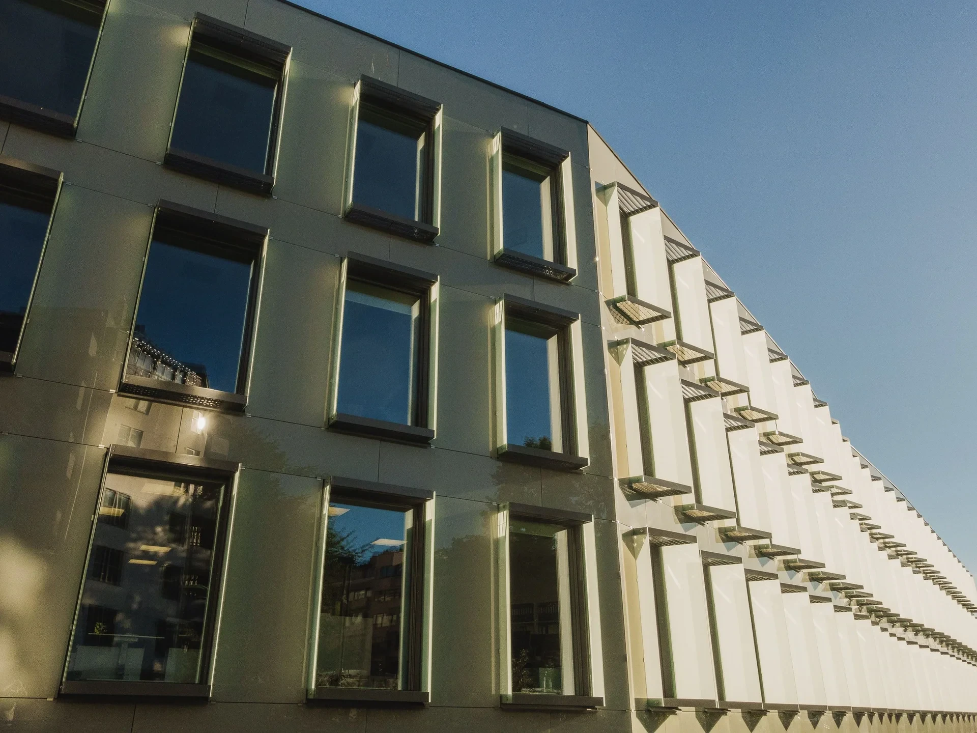 Modern facade with rows of angled windows