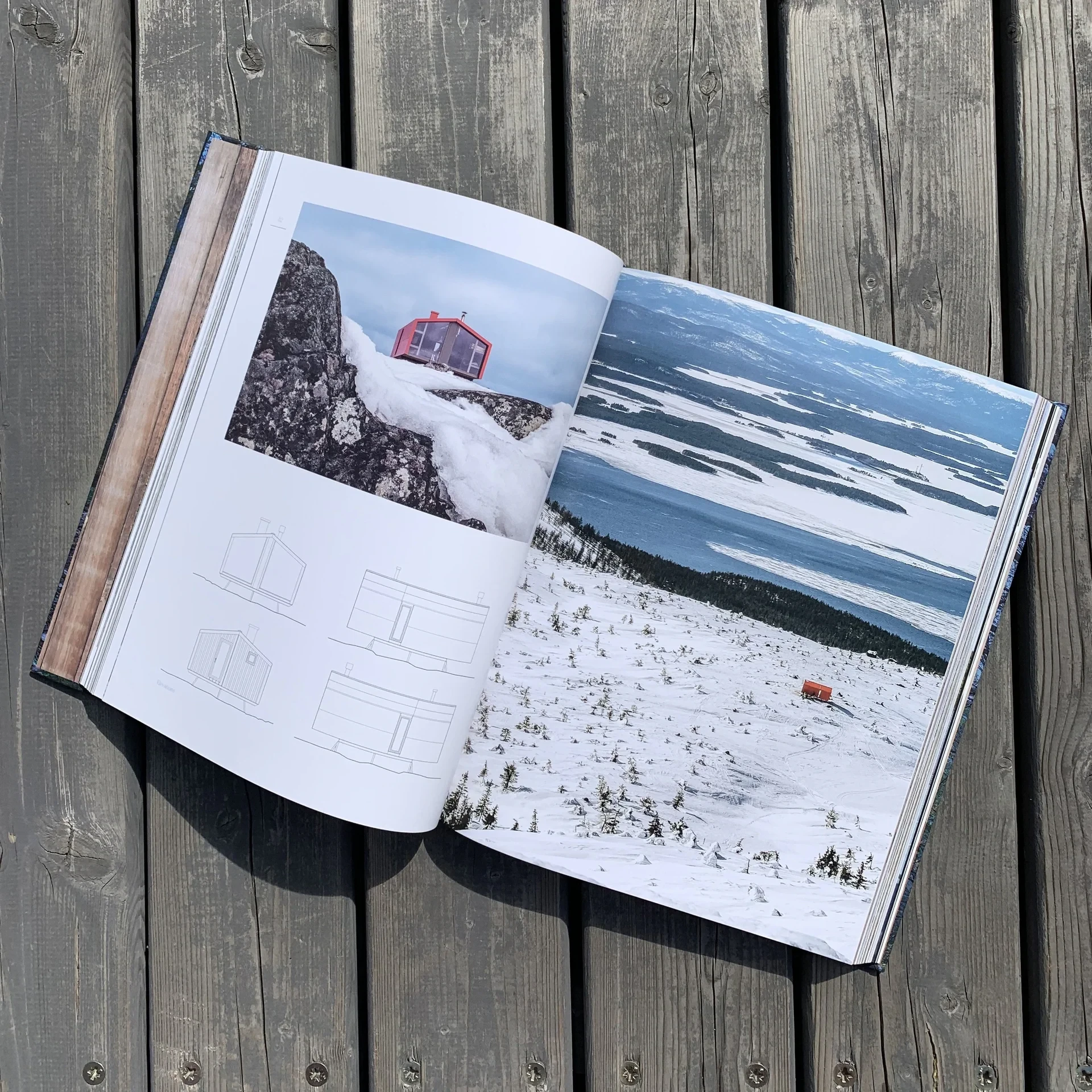 Book spread with cabin photos and floor plans