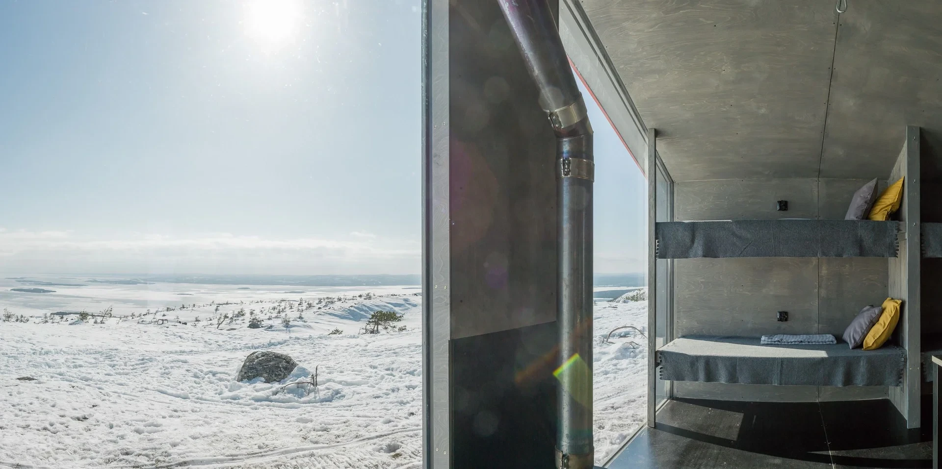 Bunk beds beside window over snow