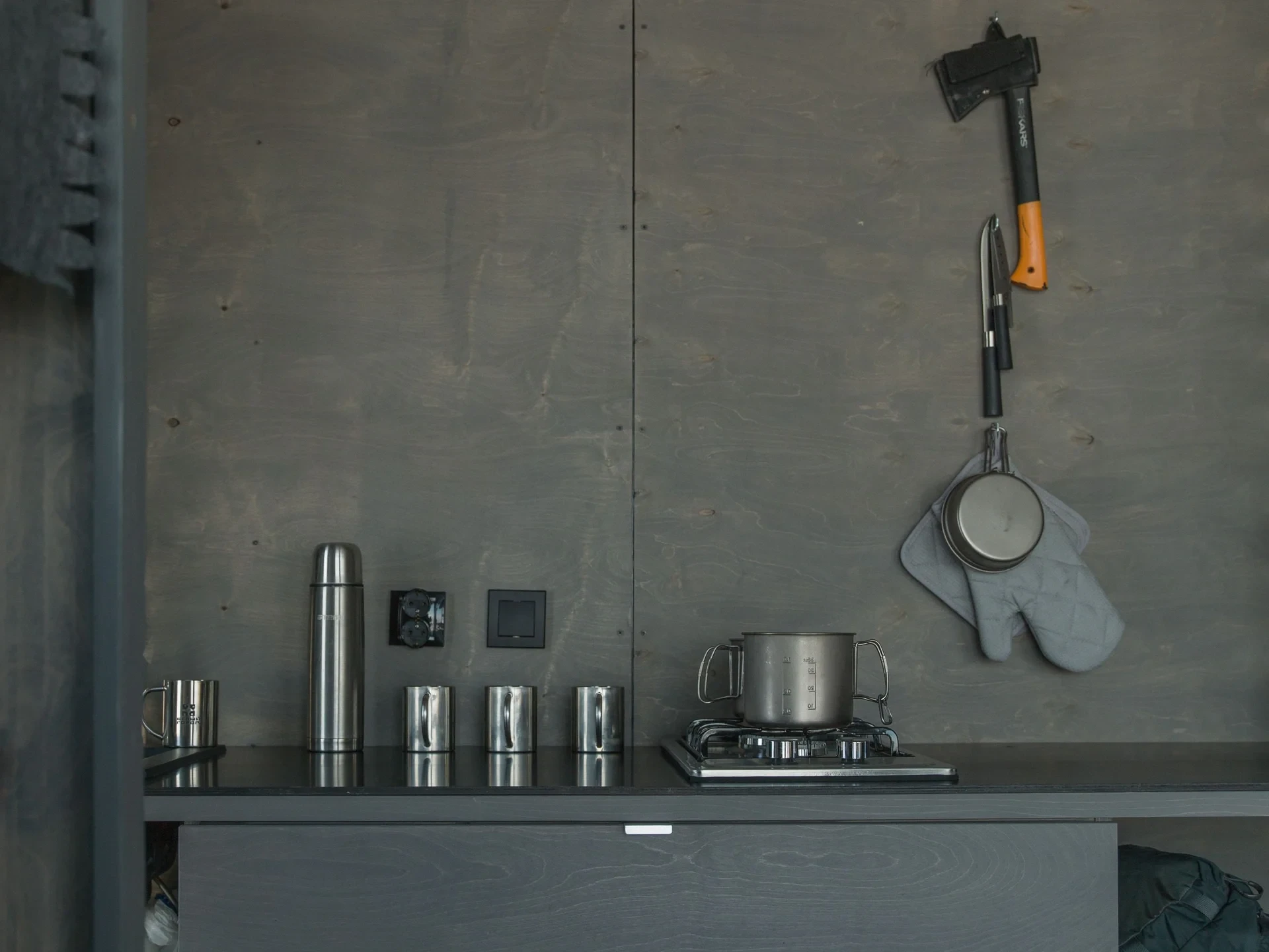 Kitchen counter with axe and thermos