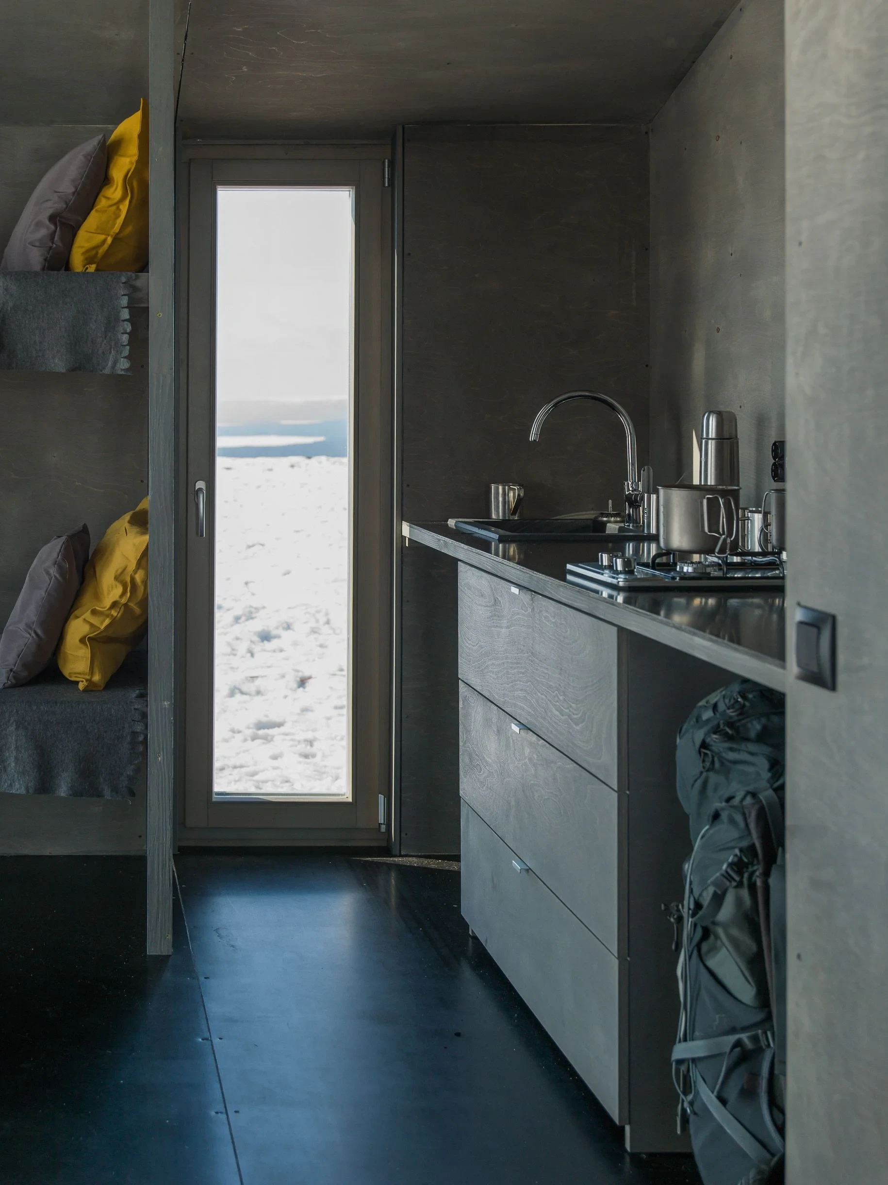 Grey interior with kitchen and bunk beds